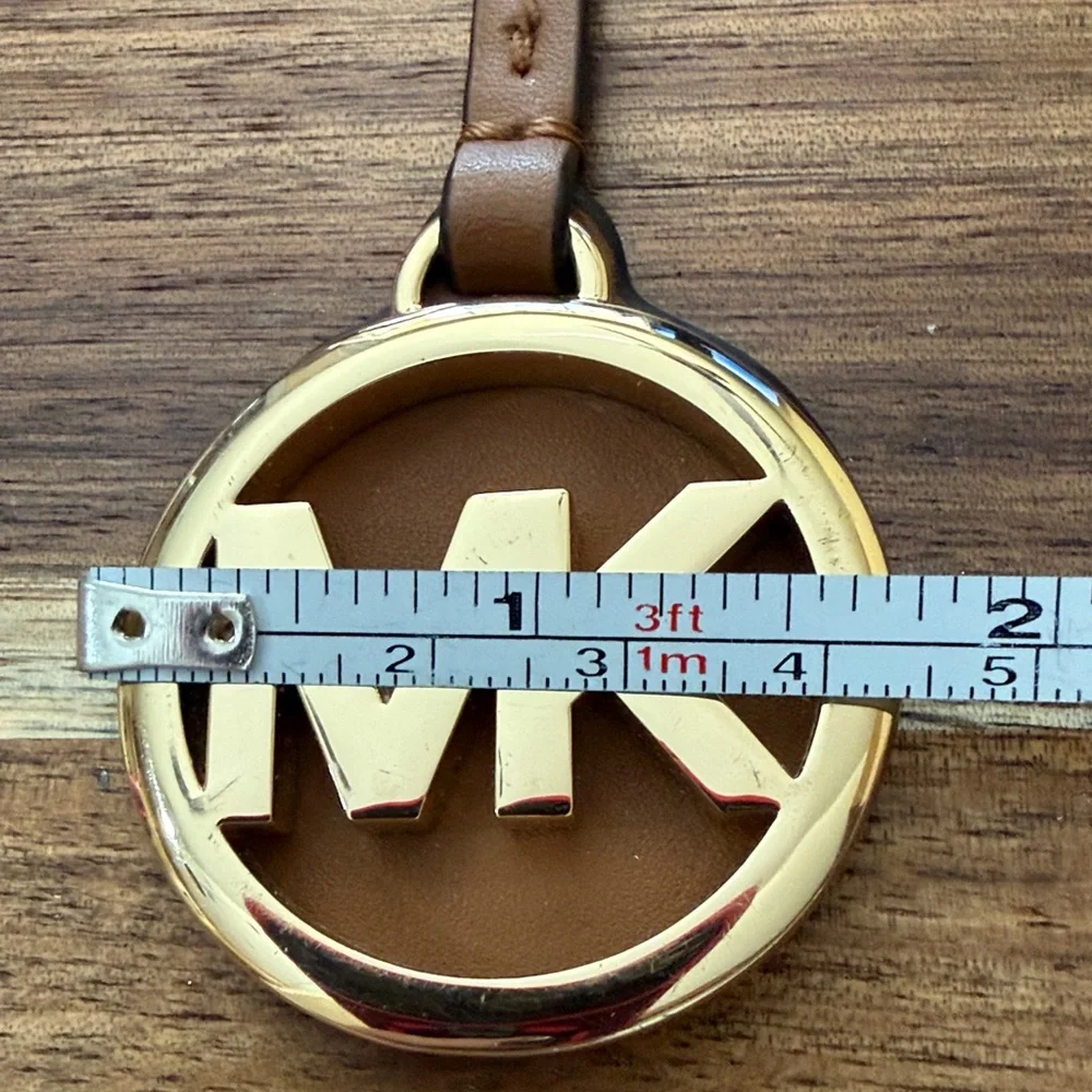 Michael Kors Brown and Gold bag tag